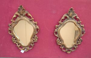 Pair of small antique carved frame mirrors.